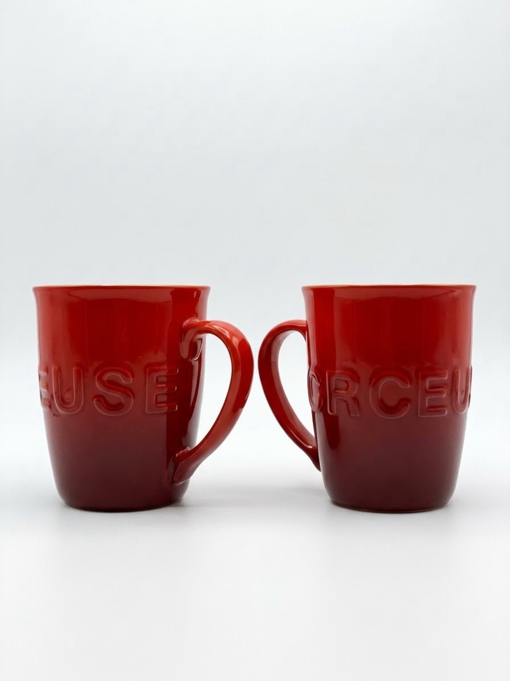 Le Creuset Cerise Red Embossed Logo Stoneware Mugs Set of 2